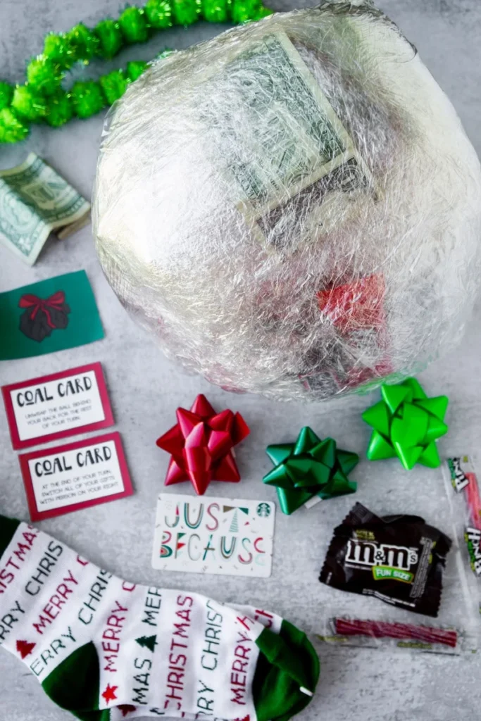 A thrilling Christmas Saran Wrap Ball Game with layers of plastic wrap containing small prizes