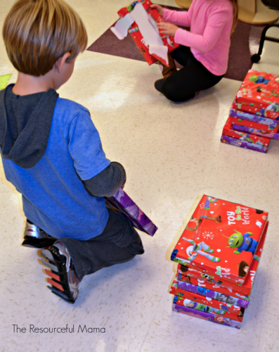 a colorful game board with various holiday-themed spaces in a festive holiday classroom game