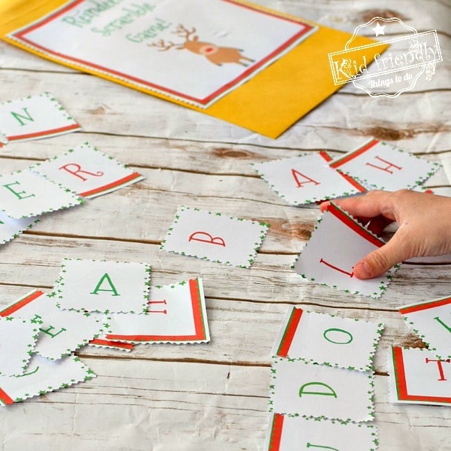 A Reindeer Scramble game sheet with jumbled letters and spaces for participants to unscramble Christmas-related words and find the hidden words associated with reindeer