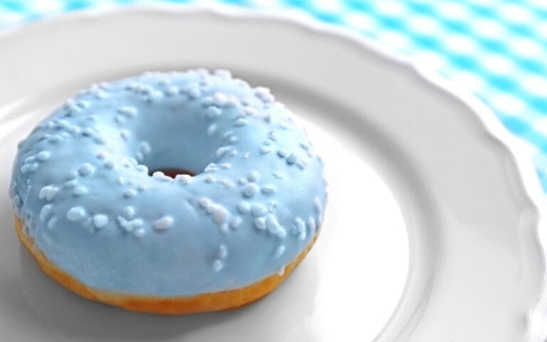 Blue donut on a white plate to signify a Donuts with Dad event