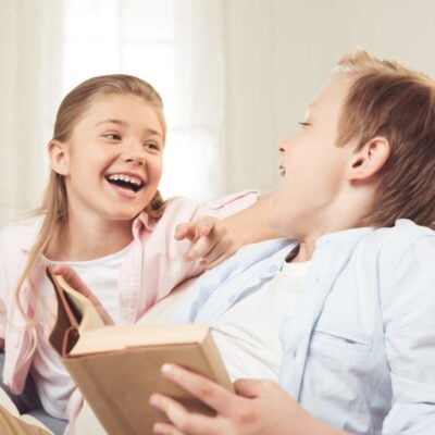 two kids laughing signifying playing a fun this or that questions game