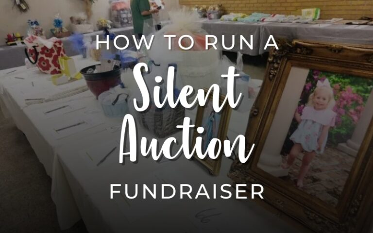 How to run a silent auction fundraiser, showing a table with various gift baskets and items arranged for bidding at a fundraising event.